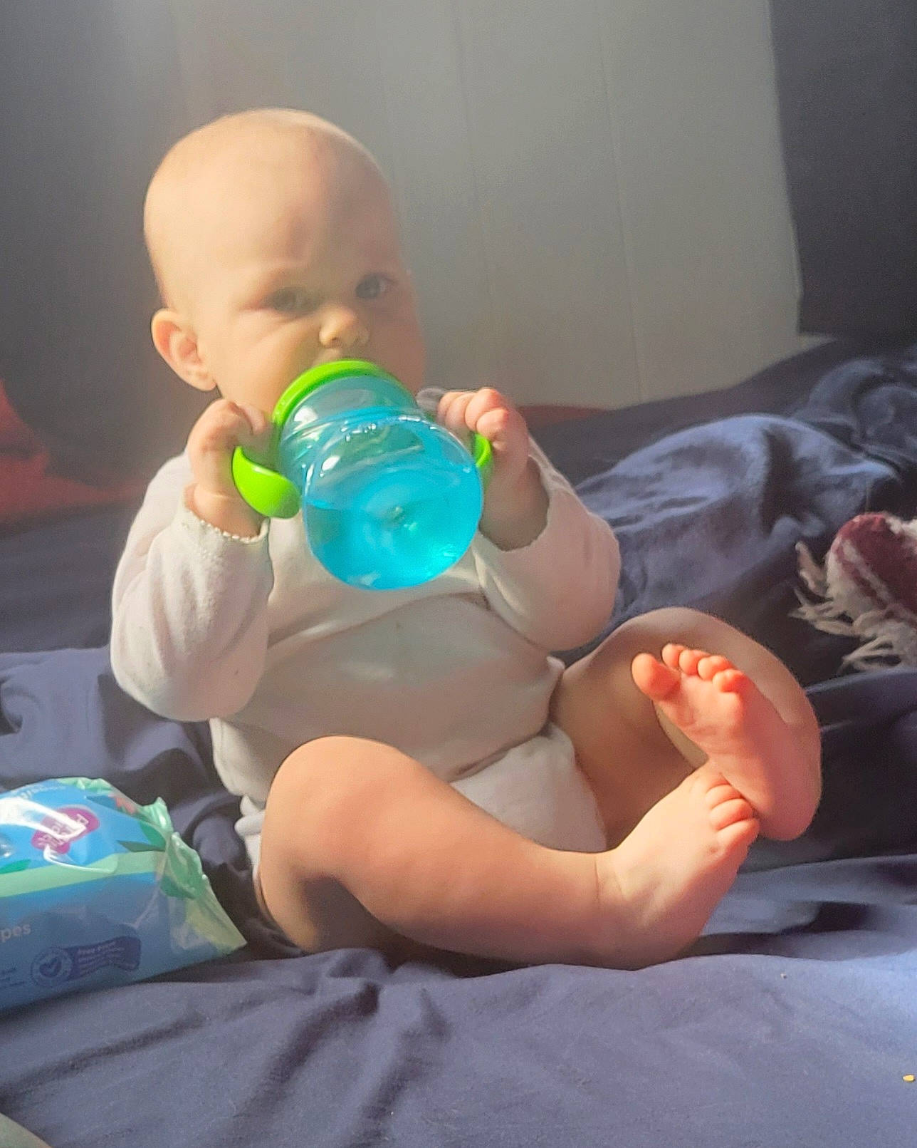 Madilynn joined the competition — help win amazing prizes! abdomen, baby, baby_bottle, bottle, comfort, drinkware, finger, fun, human_body, joint, knee, leg, mouth, person, plastic_bottle, skin, thigh, toddler, trunk, water