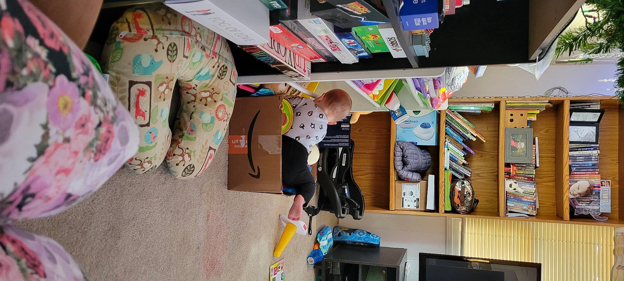 Madilynn is registered to the contest to win money with this photo: art, artist, bookcase, building, child, collection, fun, house, person, play, product, publication, recreation, room, shelf, shelving, space, t_shirt, toddler, visual_arts