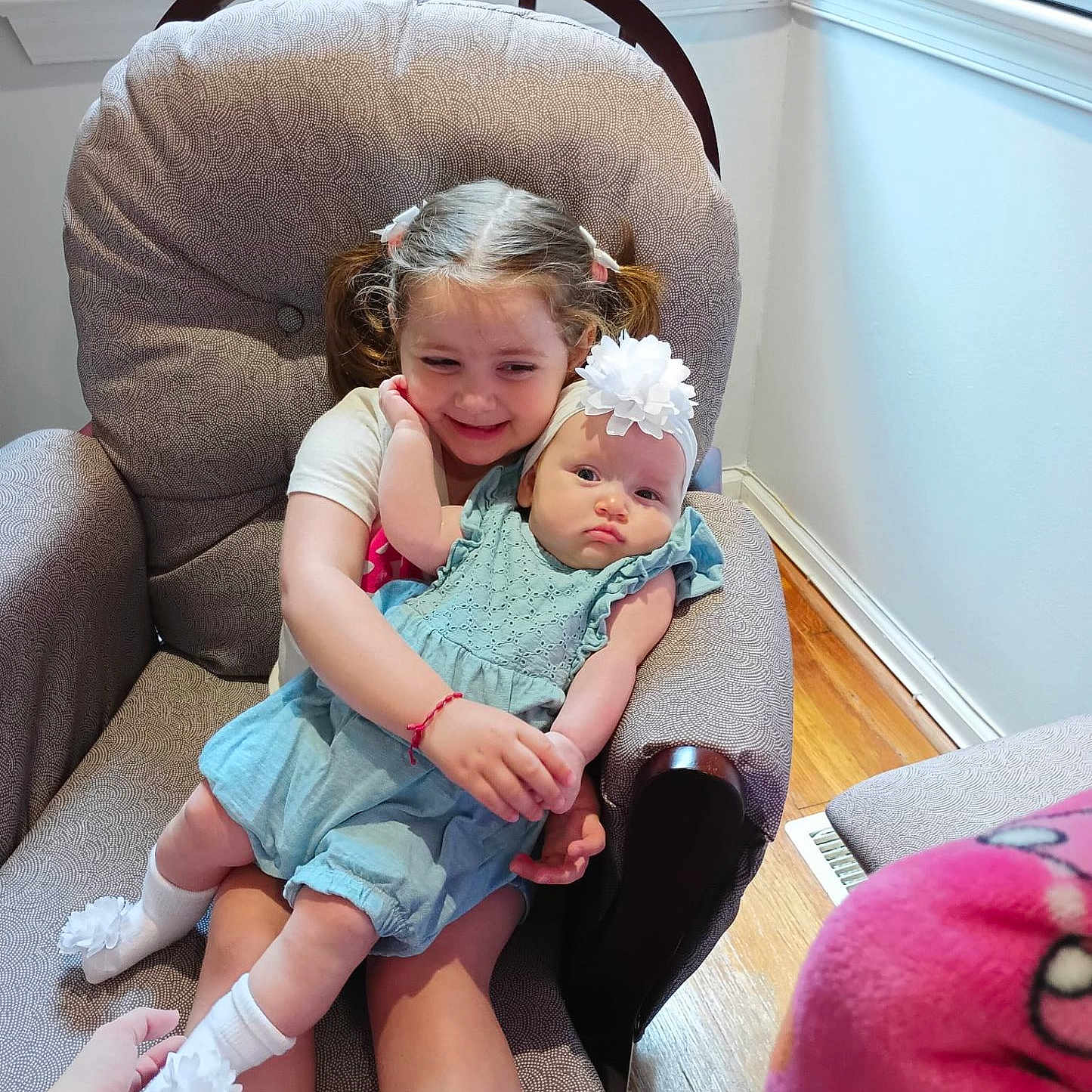 Lucia Pacheco joined the competition — help win amazing prizes! armchair, baby, child, clothing, cute, family, flower, furniture, hand, happy, headband, holding, indoor, person, pigtails, romper, smile, sock, window_blinds, wood_floor