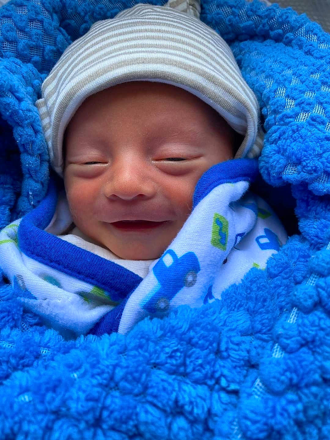 Dawson joined the competition — help win amazing prizes! azure, baby, baby_toddler_clothing, blue, cheek, child, comfort, cool, electric_blue, grass, happy, headwear, mouth, person, photograph, product, purple, skin, smile, textile