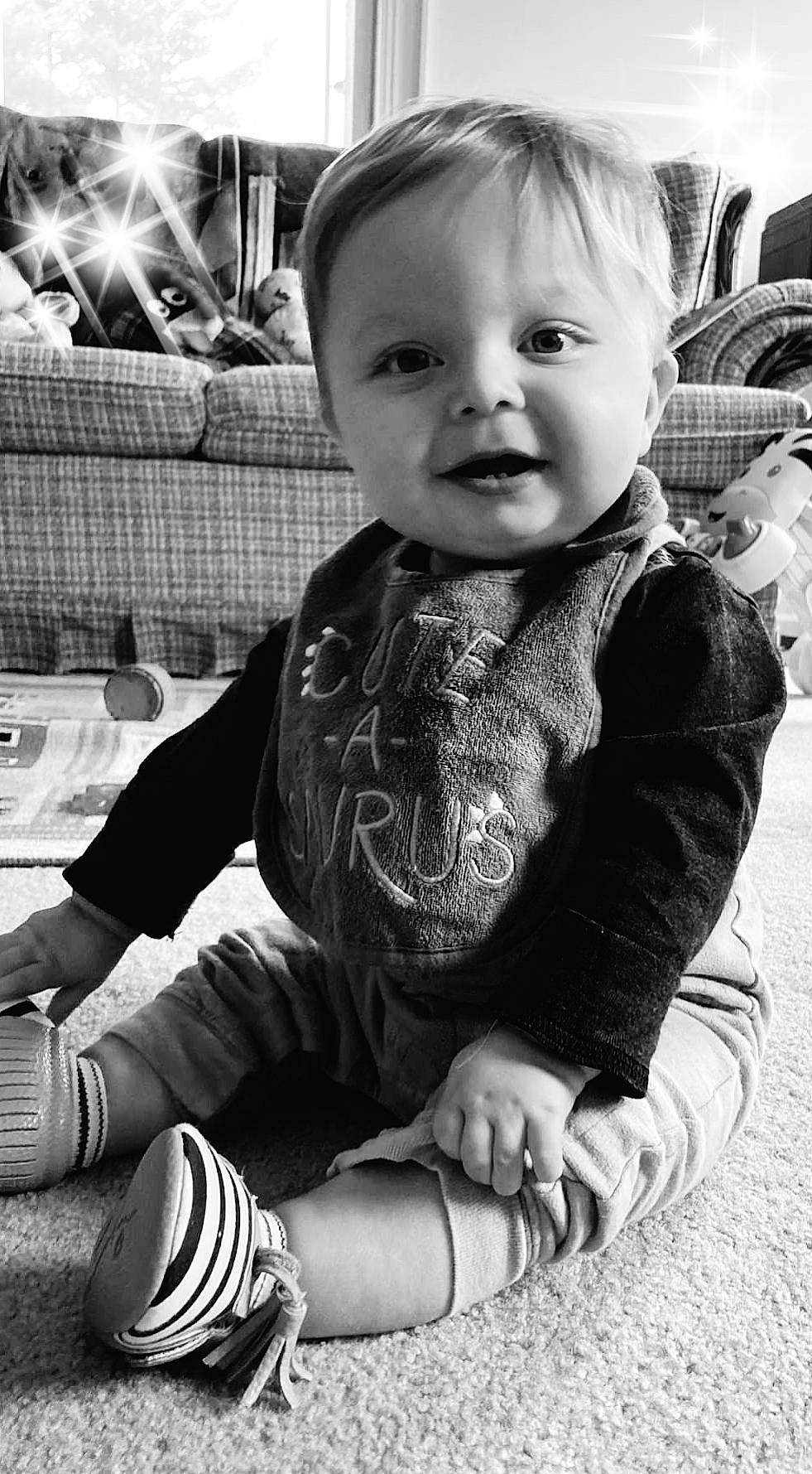 Hank is registered to the contest to win money with this photo: baby, baby_toddler_clothing, black, black_and_white, cheek, child, cool, happy, human_leg, iris, monochrome, monochrome_photography, person, photograph, sitting, sleeve, smile, snapshot, style, toddler
