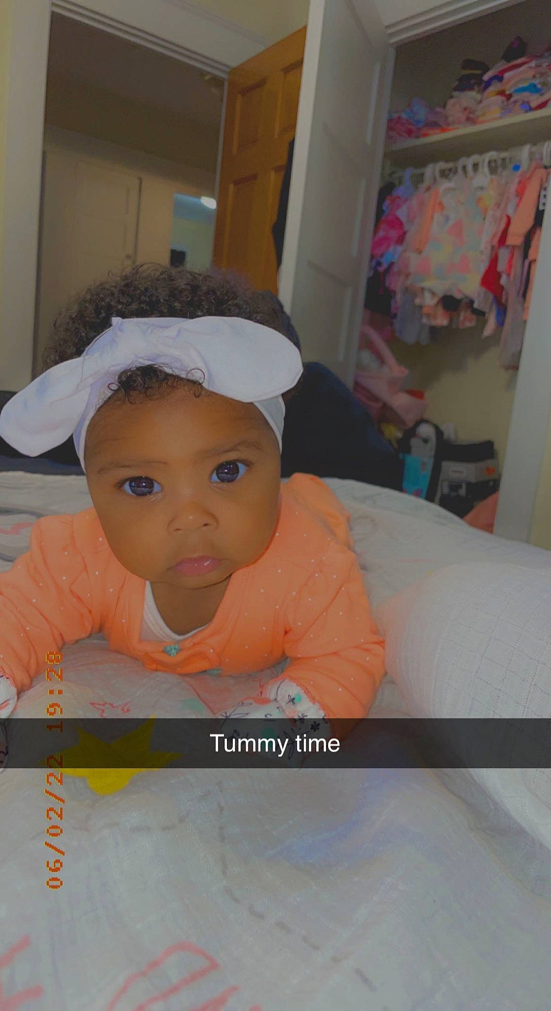 Liberty is registered to the contest to win money with this photo: baby, baby_products, baby_toddler_clothing, cap, cheek, child, eyebrow, eyelash, flooring, fun, happy, headwear, linens, person, play, room, sleeve, smile, t_shirt, textile