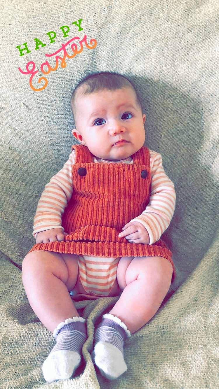 Farrah is registered to the contest to win money with this photo: baby, baby_toddler_clothing, cheek, child, child_model, design, knitting, pattern, peach, person, pink, sitting, sleeve, toddler, wool