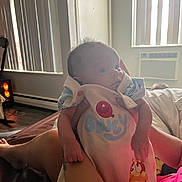 Kaisyn joined the competition — help win amazing prizes! baby, infant, person, clothing, indoor, window, air_conditioner, hand, arm, bed, blanket, vertical_blinds, door, floor, furniture, cartoon_character, cute, soft_light, holding, resting