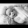 Kaisyn joined the competition — help win amazing prizes! baby, infant, smiling, wrapped, blanket, knitted, black_and_white, portrait, closeup, cute, happy, lying_down, fur_texture, soft, young_child, face, expression, newborn, cozy, warm