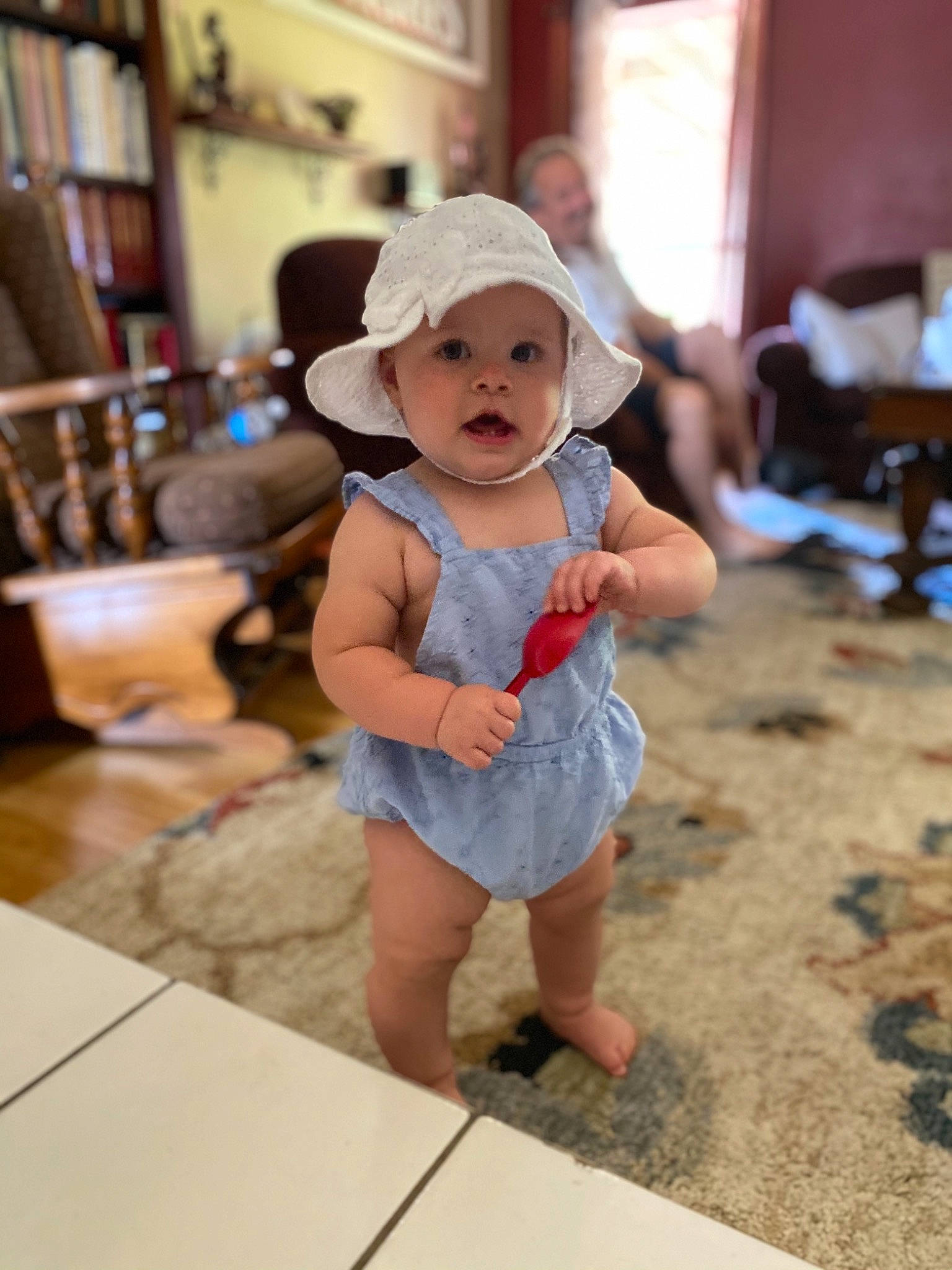 Finley joined the competition — help win amazing prizes! baby, baby_toddler_clothing, blurred, chair, child, event, flooring, fun, happy, hat, headwear, human_leg, leisure, person, picture_frame, shelf, shorts, sitting, smile, sun_hat