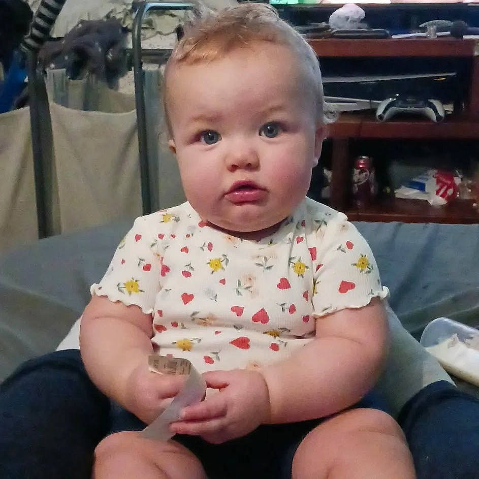 Ava is registered to the contest to win money with this photo: baby, baby_toddler_clothing, cheek, child, eye, fun, happy, human_leg, iris, pattern, person, product, shelf, sitting, skin, sleeve, thigh, thumb, toddler, vacation