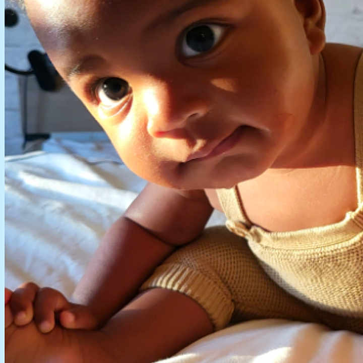 Micah is registered to the contest to win money with this photo: advertisement, ankle, art, baby, bodypart, collage, electronics, face, finger, frown, hand, head, newborn, patient, person, photography, portrait, poster, screen, text