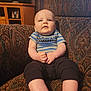 Laine is registered to the contest to win money with this photo: architecture, baby, building, chair, clothing, couch, cushion, face, furniture, head, homedecor, indoors, livingroom, pants, person, photography, portrait, room, shorts, sitting