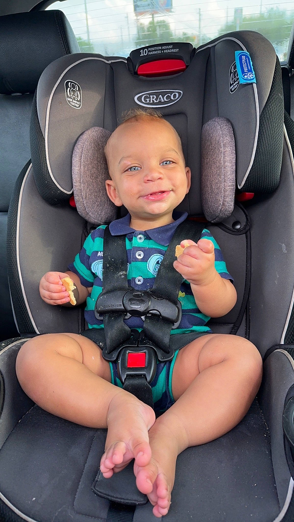 Jaxon joined the competition — help win amazing prizes! auto_part, automotive_design, baby, car, car_seat, car_seat_cover, child, comfort, electric_blue, family_car, head_restraint, motor_vehicle, person, photograph, product, sitting, smile, steering_wheel, thigh, toddler