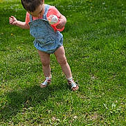 Kairi is registered to the contest to win money with this photo: baby, clothing, dress, face, footwear, grass, head, jeans, lawn, nature, outdoors, pants, person, photography, plant, portrait, sandal, shoe, shorts, yard