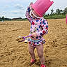 Kairi is registered to the contest to win money with this photo: bucket, child, clothing, device, face, female, footwear, girl, head, nature, outdoors, person, photography, portrait, shoe, shorts, shovel, soil, summer, tool