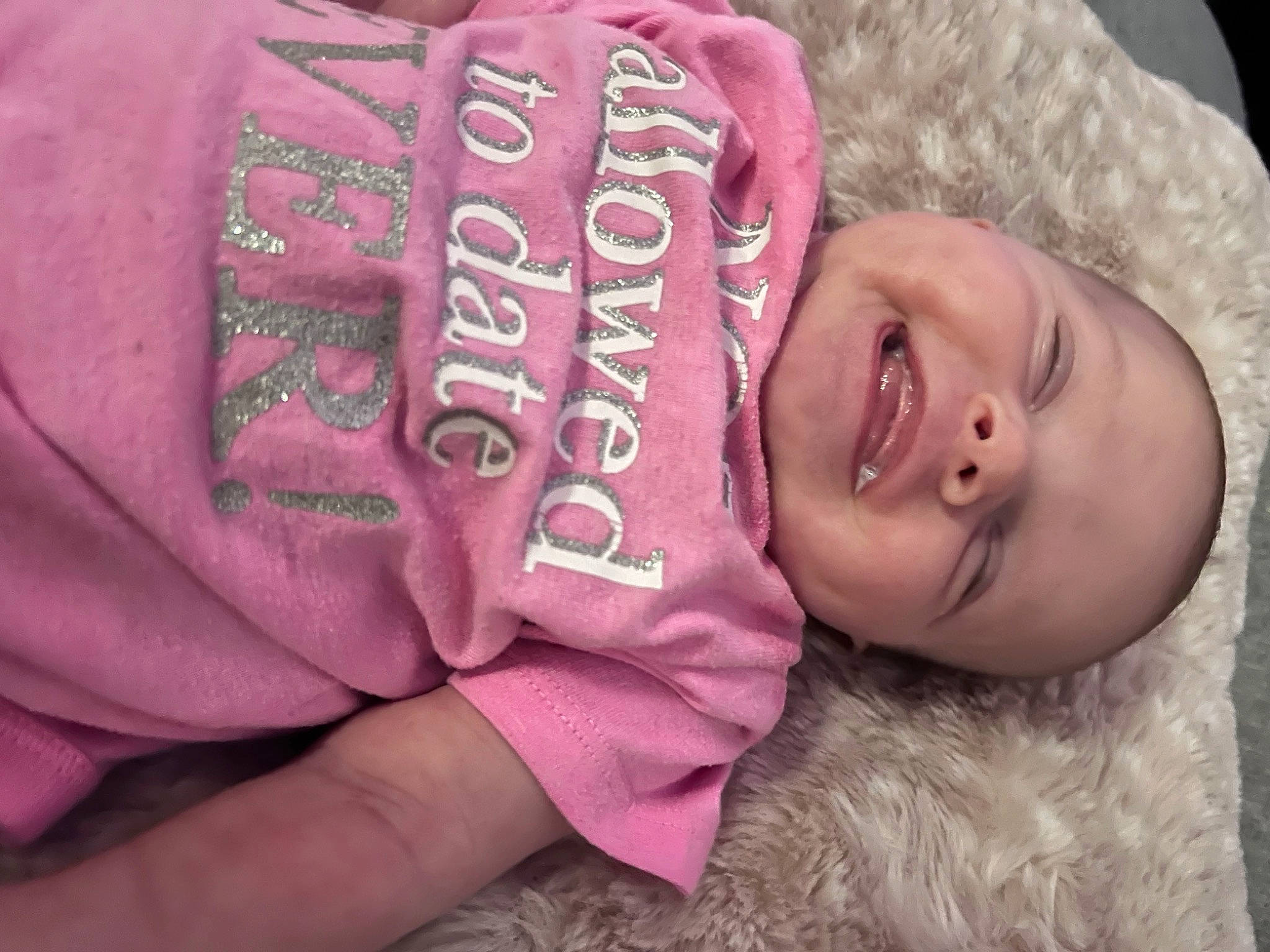 Gracelynn is registered to the contest to win money with this photo: baby, baby_laughing, baby_toddler_clothing, cap, comfort, finger, happy, hat, headgear, human_body, lip, magenta, person, pink, plant, product, skin, sleeve, smile, toddler