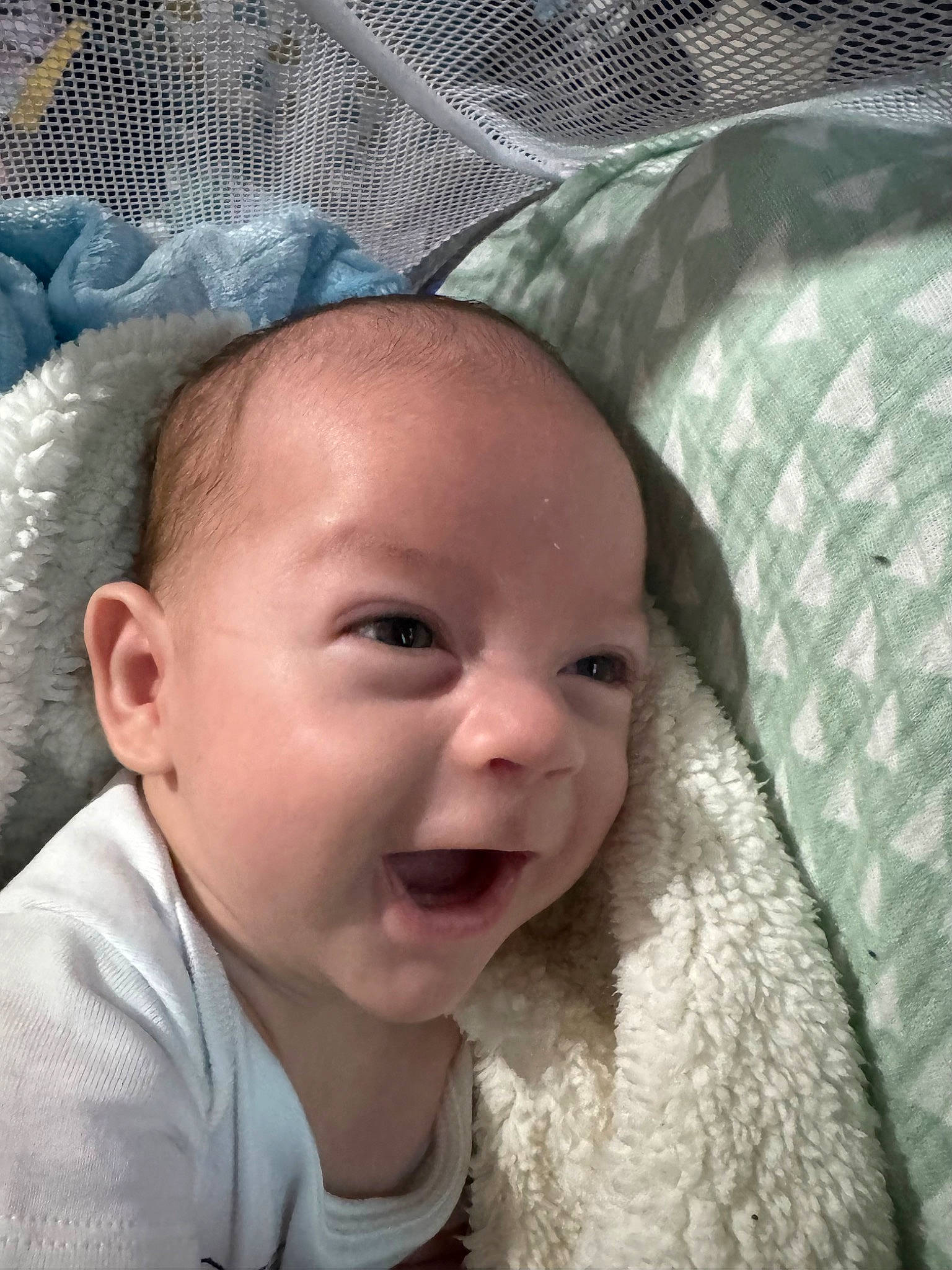 Carlyle is registered to the contest to win money with this photo: baby, baby_laughing, baby_toddler_clothing, cheek, chin, comfort, eye, eyebrow, face, happy, head, iris, lip, mouth, nose, organ, person, skin, smile, textile