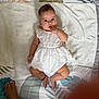 Cynthia joined the competition — help win amazing prizes! anklet, baby, blanket, child, curious_expression, cute, finger_in_mouth, foot, human, indoor, infant, leaf_pattern, lying_down, patterned_mat, portrait, skin, small, soft_lighting, toenail_paint, white_dress
