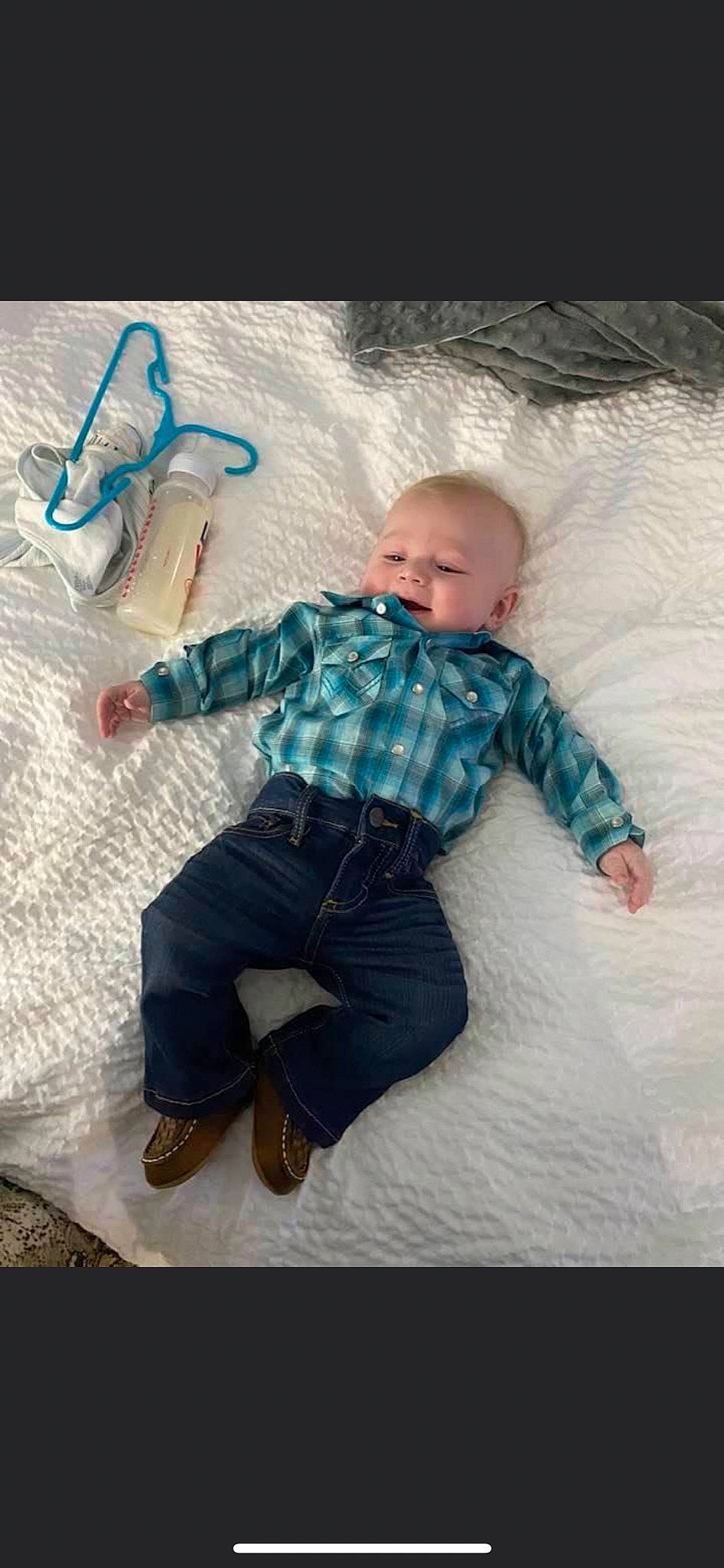 Kolt is registered to the contest to win money with this photo: baby, baby_toddler_clothing, child, comfort, cool, footwear, fun, happy, leg, linens, pattern, person, plaid, shoe, sitting, sleeve, sneakers, t_shirt, textile, toddler