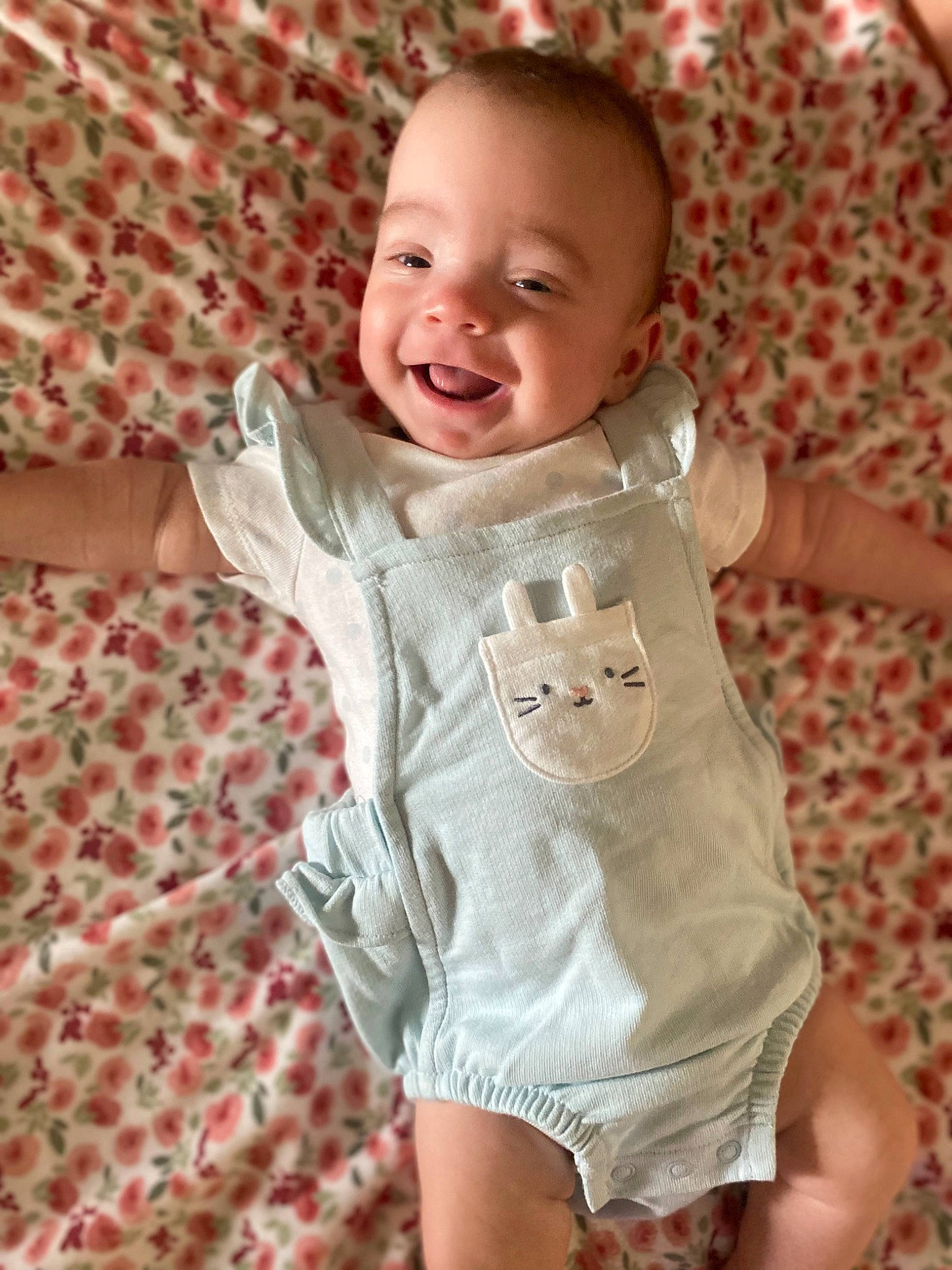 Lettie is registered to the contest to win money with this photo: arm, baby_toddler_clothing, cheek, dress, eye, face, finger, happy, head, human_body, joint, lip, mammal, person, pink, product, skin, sleeve, smile, standing