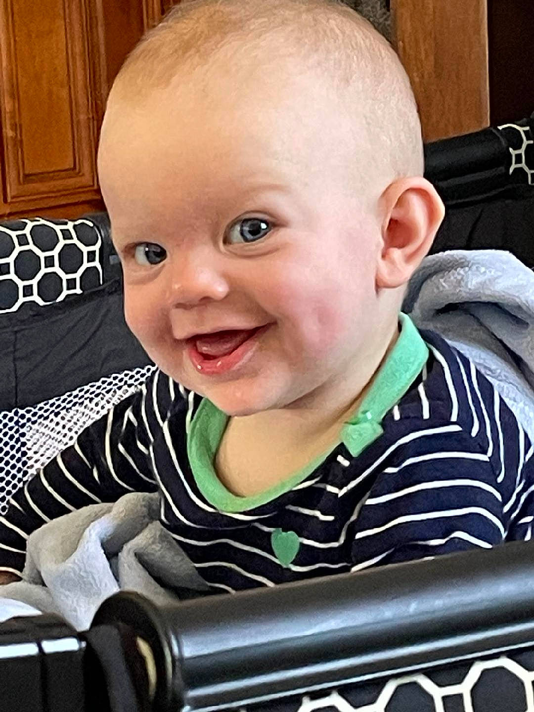 Willow is registered to the contest to win money with this photo: baby, baby_toddler_clothing, cabinetry, cheek, child, chin, comfort, eyelash, facial_expression, fun, happy, iris, joy, laugh, person, portrait_photography, product, sitting, sleeve, smile