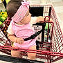 Marbella Esparza is registered to the contest to win money with this photo: baby, girl, shopping_cart, pink_clothing, headband, grocery_store, watermelon, floor, bottle, seatbelt, curious, child, toddler, shopping, retail, infant, cart_handle, casual, indoor, socks