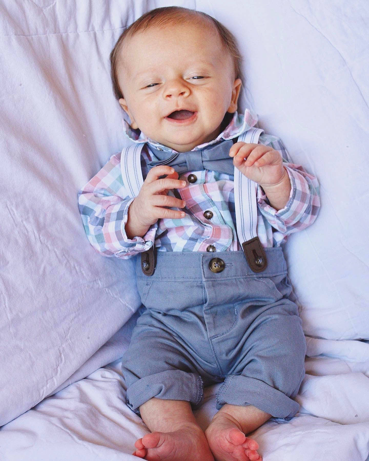 Griffin is registered to the contest to win money with this photo: baby, baby_toddler_clothing, beauty, cheek, child, collar, comfort, dress_shirt, face, finger, gesture, hand, happy, person, pink, product, skin, sleeve, smile, textile