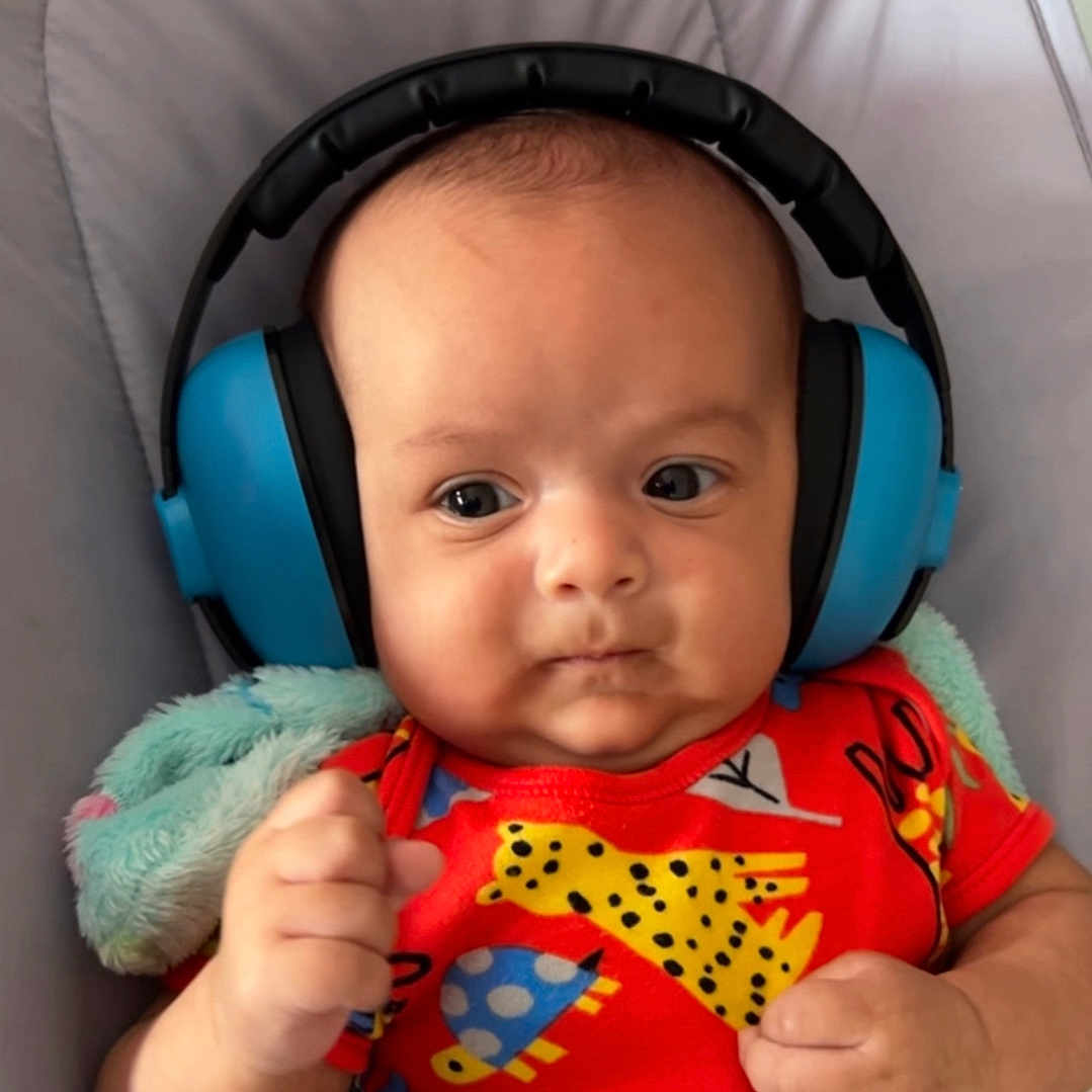 Hari joined the competition — help win amazing prizes! animal_print, baby, blanket, child, colorful_clothing, comfort, cushion, cute, expression, face, fist, headphones, indoor, infant, newborn, person, portrait, skin, soft, young