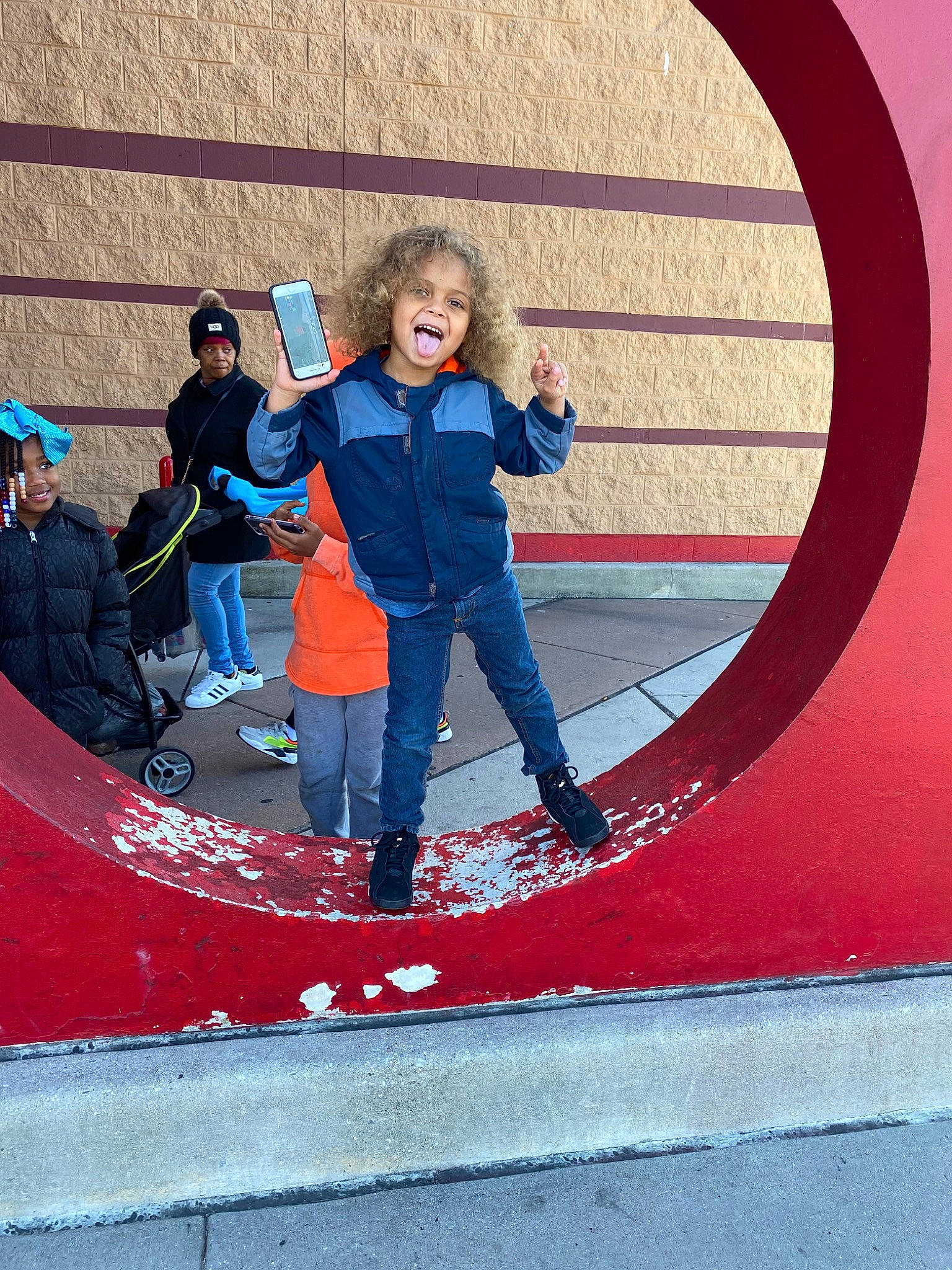 Kadyn is registered to the contest to win money with this photo: child, denim, fun, headwear, jeans, joy, leisure, person, play, recreation, red, smile