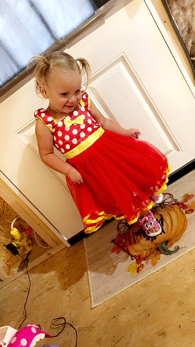 Annalice is registered to the contest to win money with this photo: baby, baby_toddler_clothing, chair, child, companion_dog, door, floor, flooring, fun, happy, human_leg, joy, magenta, orange, pattern, peach, person, room, sandal, sitting