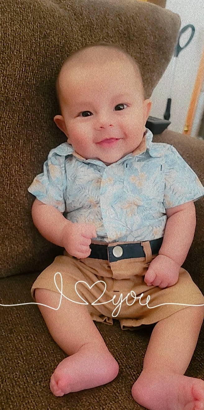 Drew is registered to the contest to win money with this photo: baby, baby_toddler_clothing, cheek, dress, eye, face, happy, head, human_body, iris, lip, nose, organ, person, pink, skin, sleeve, smile, t_shirt, thigh