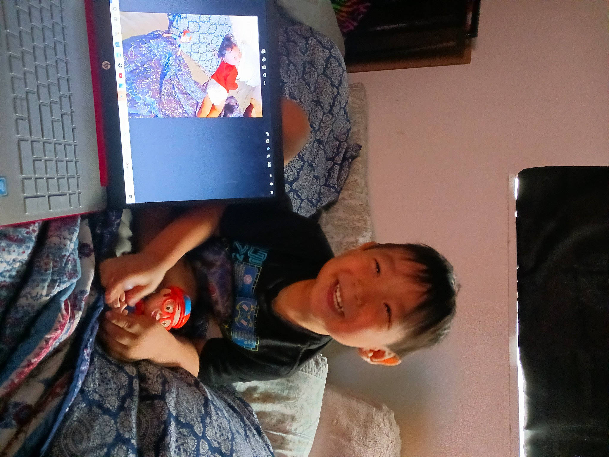 Preston is registered to the contest to win money with this photo: child, computer, computer_hardware, computer_keyboard, elbow, electric_blue, fun, happy, input_device, joy, laptop, netbook, peripheral, person, personal_computer, picture_frame, room, smile, space_bar, t_shirt