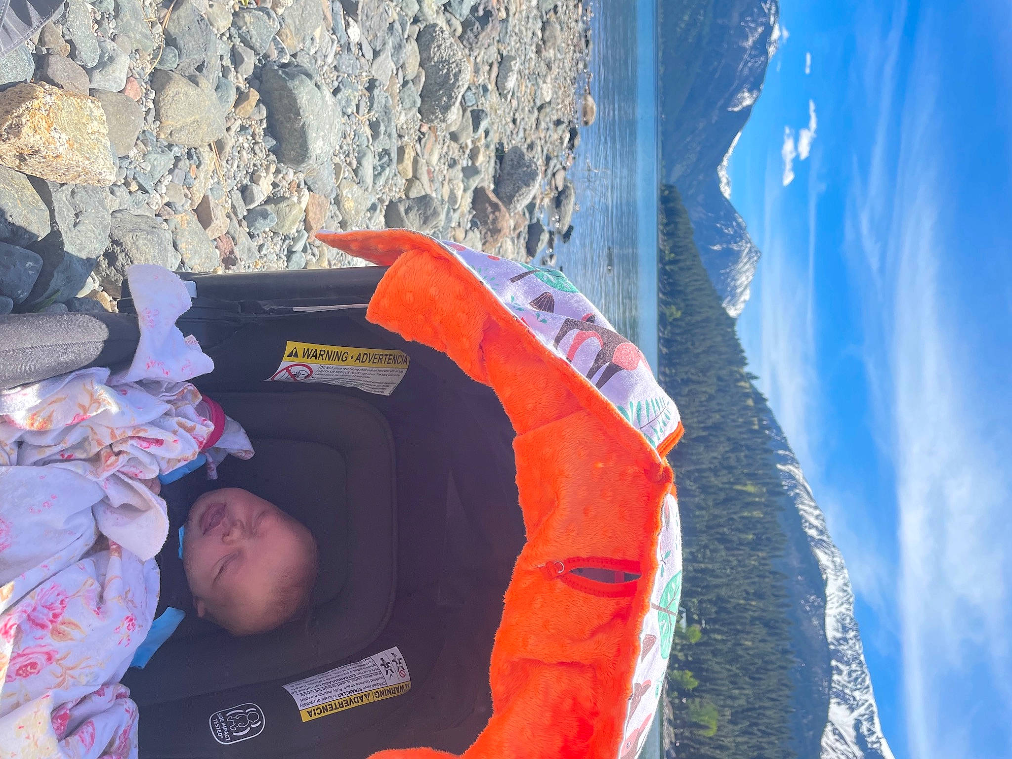 Kynlee is registered to the contest to win money with this photo: adventure, azure, baby, blue, cloud, electric_blue, fun, geology, leisure, mountain, mountain_range, person, personal_protective_equipment, recreation, rock, sky, toddler, travel, water, winter