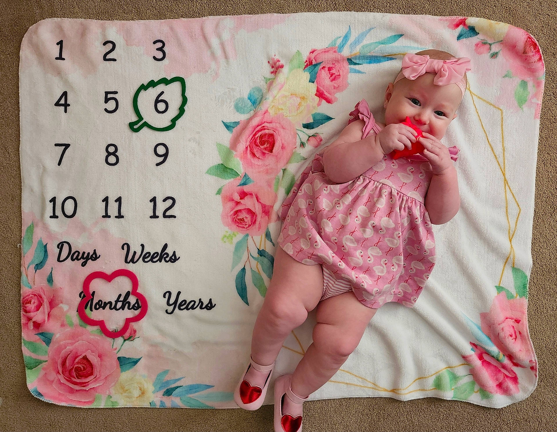 Emmi is registered to the contest to win money with this photo: baby, birthdaycake, cake, clothing, cushion, face, flower, footwear, head, highheel, homedecor, number, person, photography, plant, portrait, rose, shoe, symbol, text