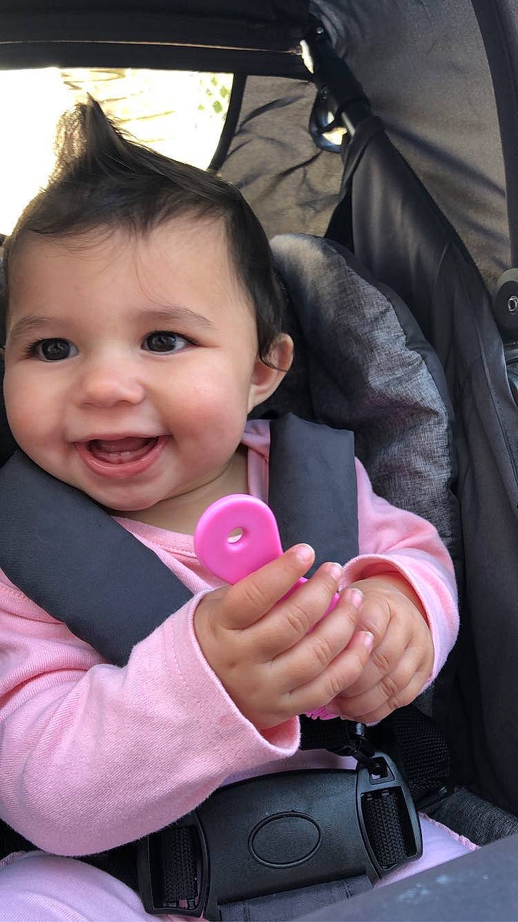 Meline participe au concours pour gagner de l'argent avec cette photo : baby, cheek, child, comfort, facial_expression, finger, gesture, hand, happy, joy, lip, magenta, nose, person, pink, plant, sitting, skin, smile, thumb