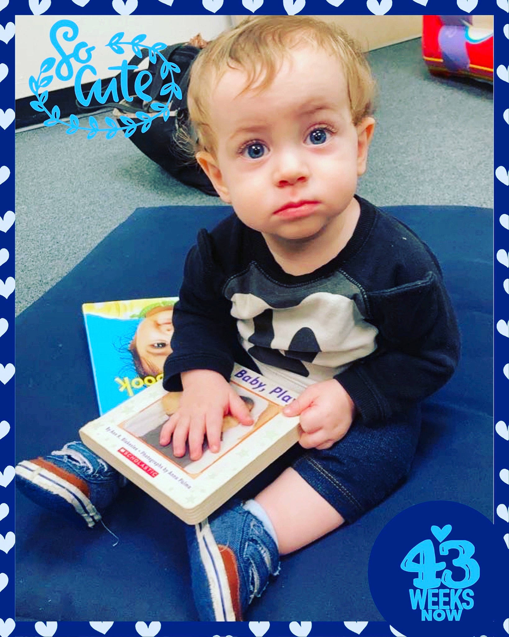 Sly joined the competition — help win amazing prizes! baby, baby_products, baby_toddler_clothing, blue, book, child, electric_blue, font, fun, pattern, person, photo_caption, play, product, publication, rectangle, room, sitting, sleeve, t_shirt