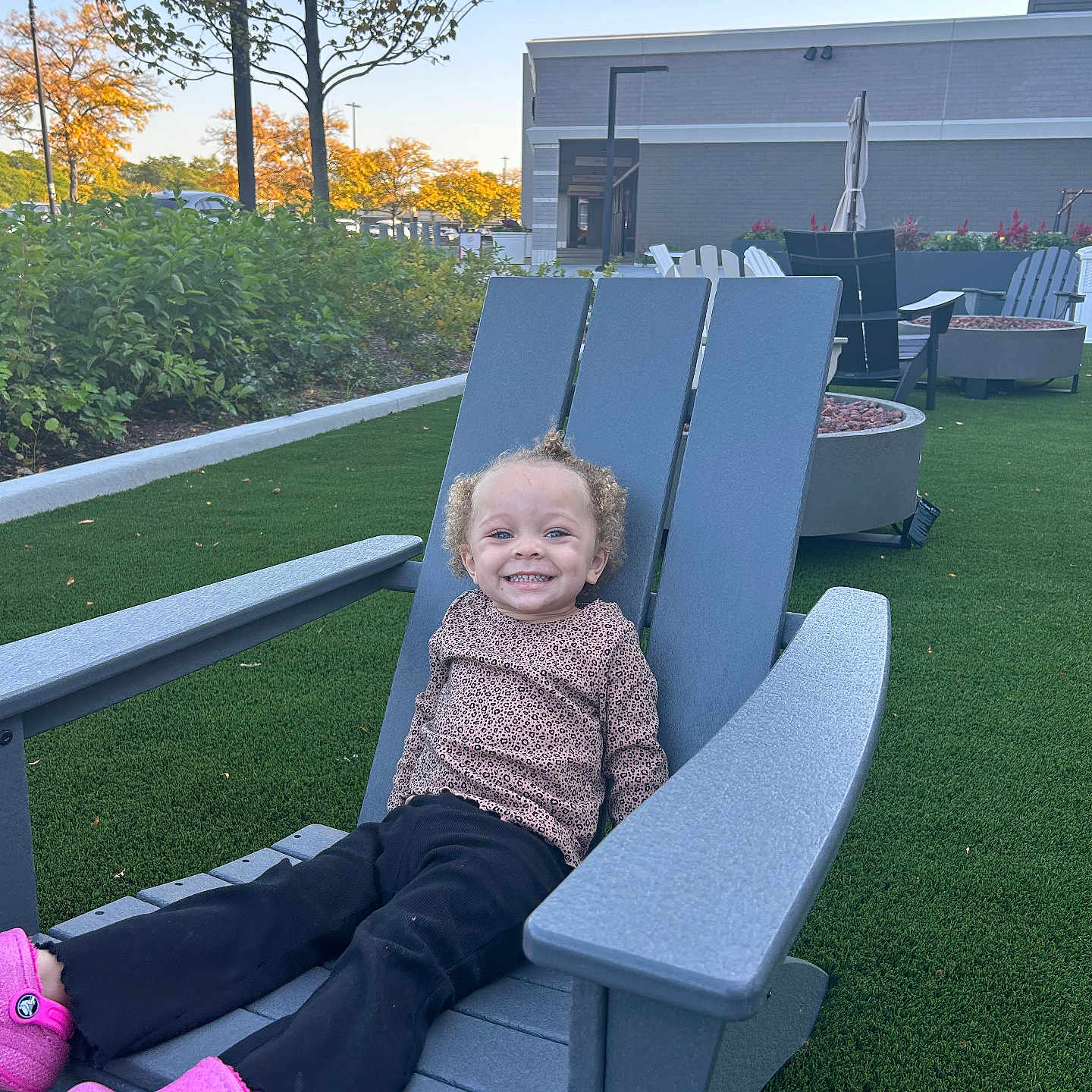 Eliahna joined the competition — help win amazing prizes! car, child, clothing, face, female, footwear, furniture, girl, grass, head, nature, outdoors, pants, park, person, photography, plant, portrait, shoe, sitting
