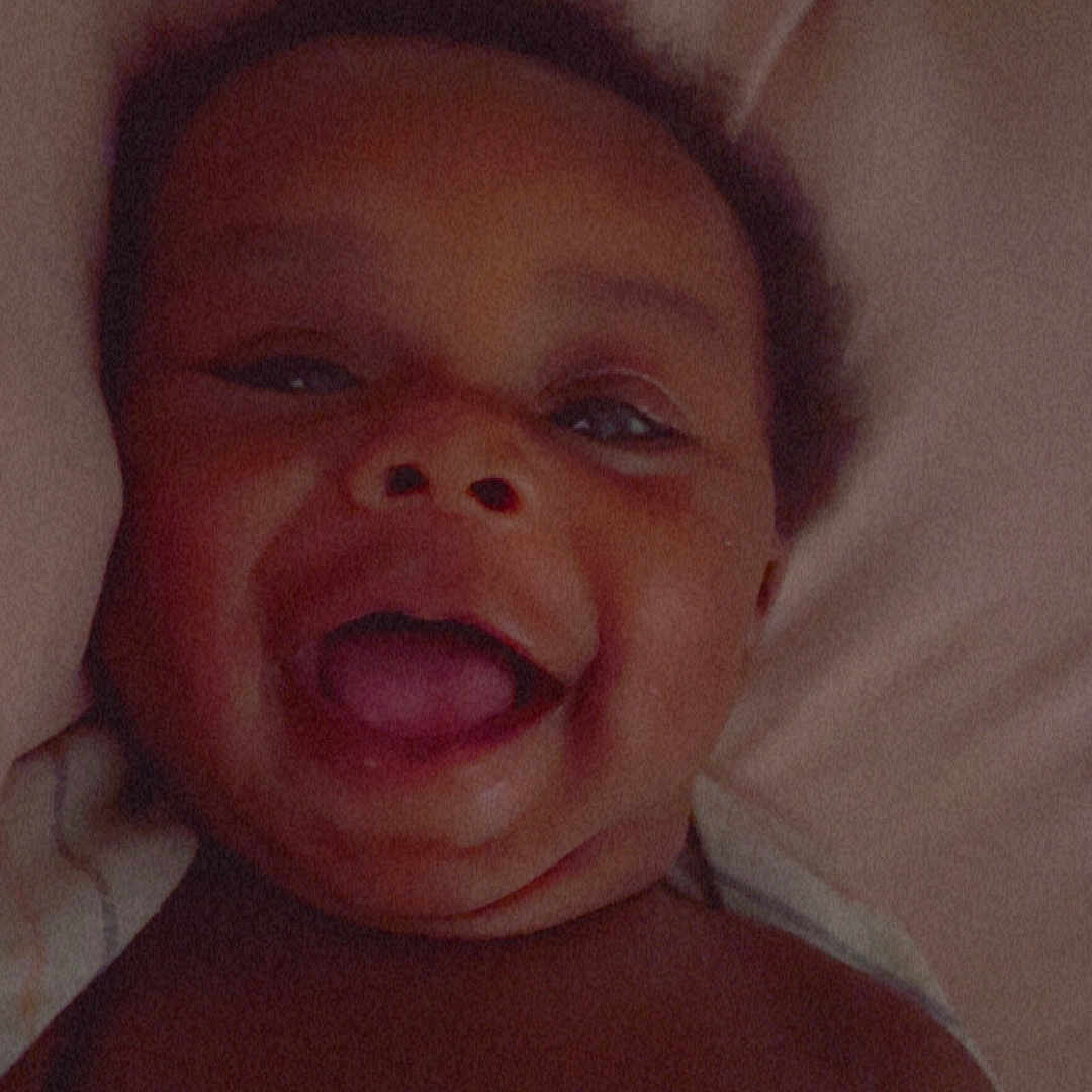 Kaceyion joined the competition — help win amazing prizes! baby, smiling, face, portrait, infant, child, skin, happy, lying_down, expression, mouth_open, head, closeup, indoors, blanket, cute, joy, young, human, peaceful