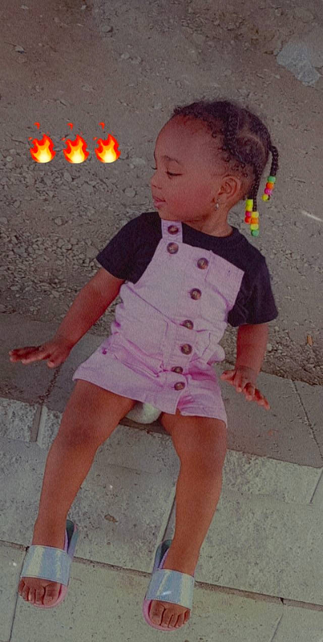 A'Kirah is registered to the contest to win money with this photo: baby_toddler_clothing, barefoot, dress, fun, hairstyle, happy, head, human_body, knee, magenta, pattern, person, pink, sand, skin, sleeve, standing, summer, thigh, toddler