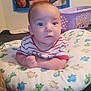 Alejandro joined the competition — help win amazing prizes! baby, pillow, dinosaur_pattern, laundry_basket, family_photos, indoor, child, person, bedroom, wall, curious, looking, clothing, striped_shirt, tattoo, hand, face, head, expression, soft_lighting
