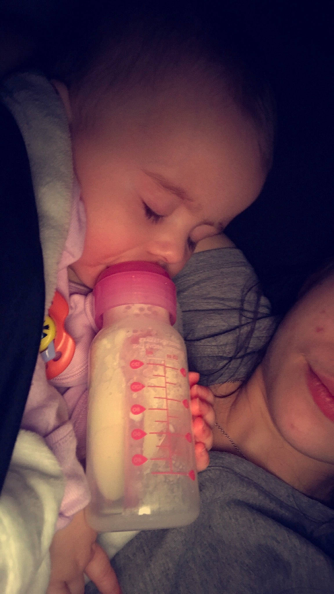 Adrianna is registered to the contest to win money with this photo: baby, baby_bottle, bottle, cheek, drinkware, ear, finger, fluid, gesture, hand, iris, lip, milk, mouth, neck, nose, person, plastic_bottle, product, skin