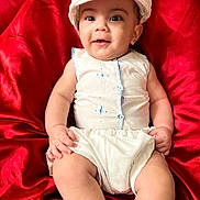 Adrián joined the competition — help win amazing prizes! baby, bodypart, cap, clothing, couch, cushion, diaper, face, finger, furniture, hand, hat, head, homedecor, newborn, person, photography, portrait, shorts, sitting