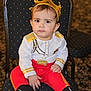 toddler, child, crown, costume, prince, red_pants, black_boots, chair, indoor, portrait, serious_expression, baby, seat, clothing, person, cute, fashion, sitting, young_child, face
