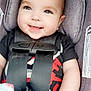 baby, smiling, car_seat, child, infant, straps, blanket, black_shirt, happy, cute, face, person, seatbelt, portrait, closeup, blue_eyes, hair, sitting, indoors, child_safety
