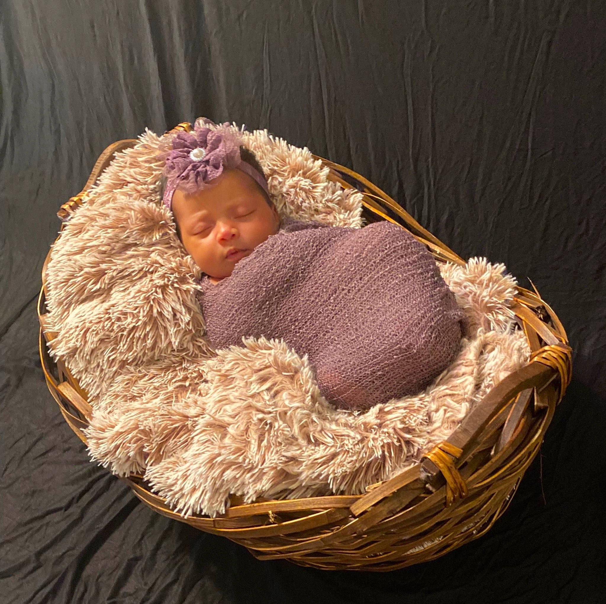 Lazayne joined the competition — help win amazing prizes! baby, baby_toddler_clothing, basket, circle, comfort, costume_hat, fashion_accessory, fur, grass, hat, home_accessories, linens, person, sitting, storage_basket, straw, toddler, wicker, wood, wool