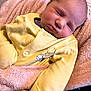 Theo is registered to the contest to win money with this photo: newborn, baby, sleeping, blanket, yellow_onesie, winnie_the_pooh, soft_texture, infant, peaceful, cute, child, face, portrait, cozy, clothing, indoor, resting, skin, head, small