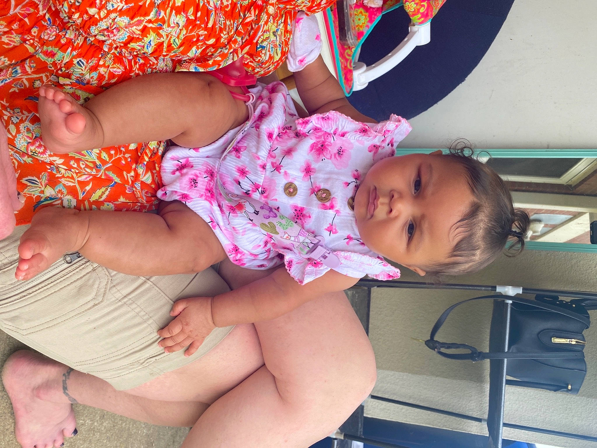 Dani is registered to the contest to win money with this photo: baby_toddler_clothing, cheek, child, comfort, facial_expression, finger, happy, human_body, joint, knee, leg, mouth, muscle, person, pink, shorts, skin, t_shirt, thigh, toddler