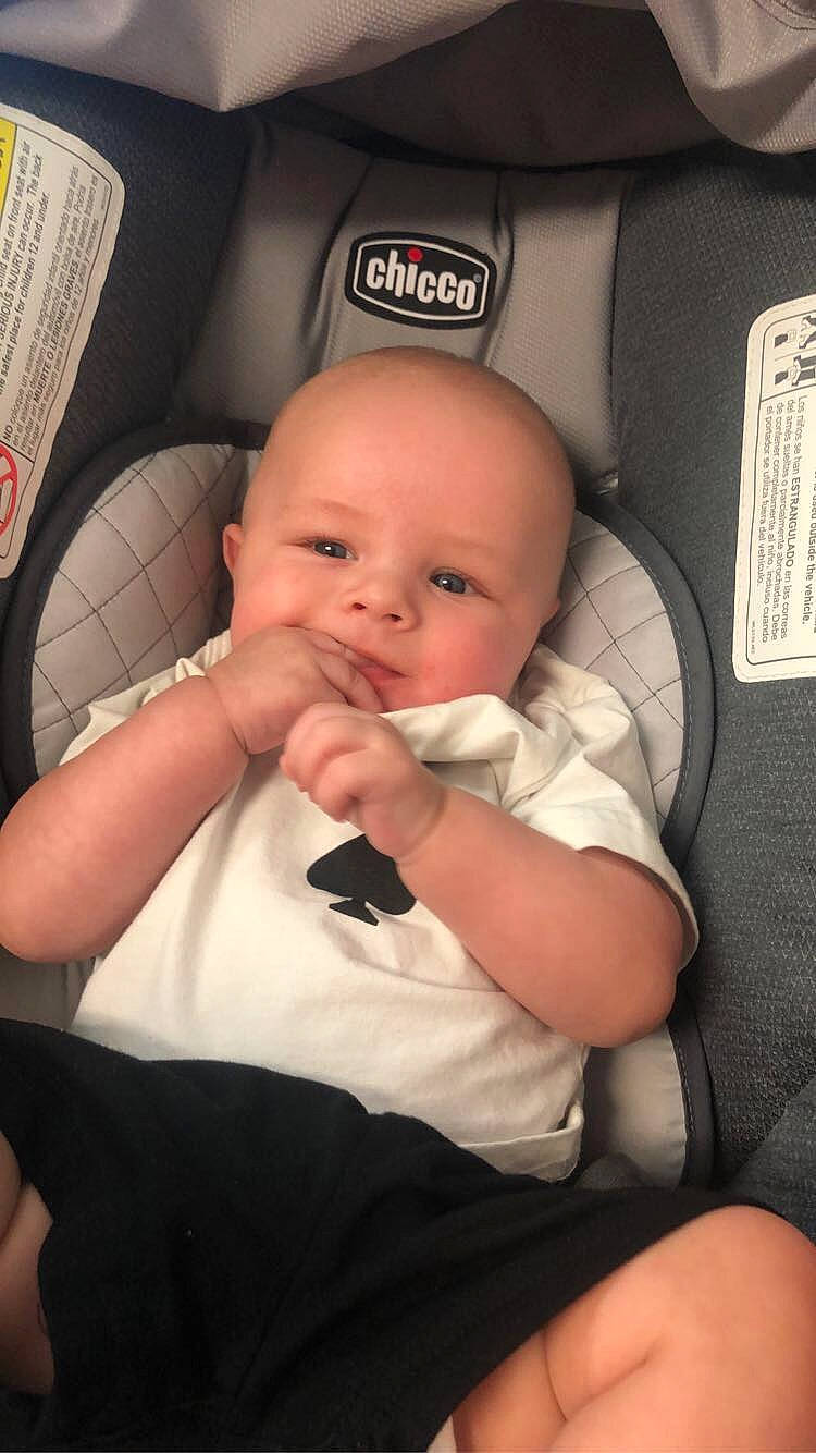 Landon is registered to the contest to win money with this photo: auto_part, automotive_design, automotive_tire, baby, baby_in_car_seat, baby_products, baby_toddler_clothing, car_seat, chair, cheek, child, comfort, finger, flash_photography, gesture, nail, person, sitting, skin, thumb