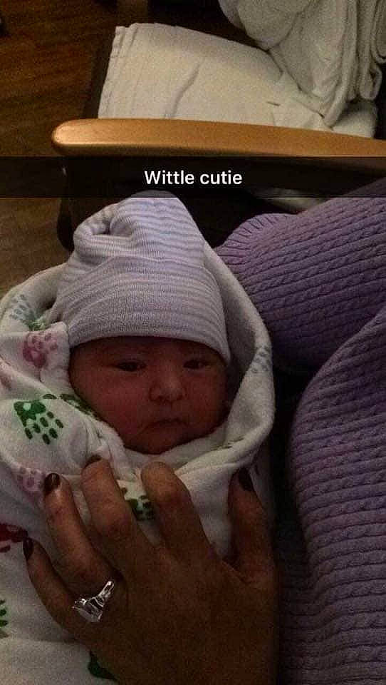 Kacie is registered to the contest to win money with this photo: arm, baby, birth, child, childbirth, hand, head, headgear, headwear, human, person, photo_caption, skin, smile, toddler