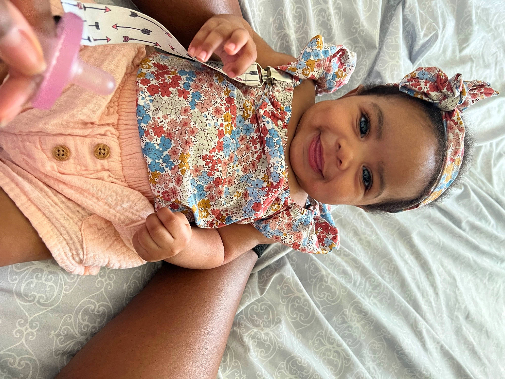 Nylah is registered to the contest to win money with this photo: abdomen, baby_toddler_clothing, child, dress, finger, hand, happy, human_body, human_leg, joy, nail, neck, pattern, person, skin, sleeve, smile, thigh, thumb, toddler