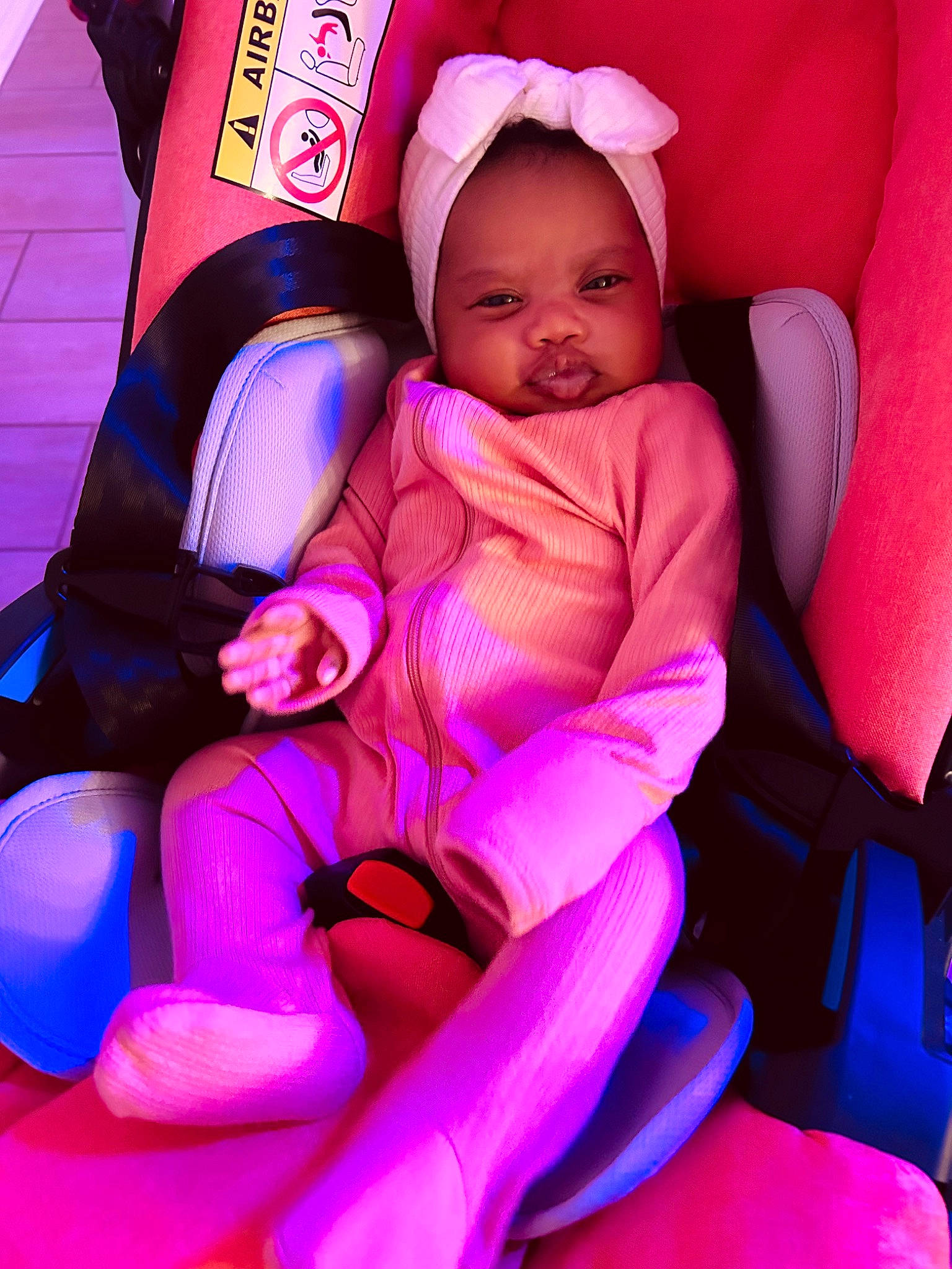 Nova joined the competition — help win amazing prizes! baby, baby_carriage, baby_toddler_clothing, car_seat, child, comfort, electric_blue, fun, human_leg, knee, lap, magenta, person, pink, purple, seat_belt, sitting, thigh, thumb, toddler