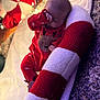 Mattie-Jean joined the competition — help win amazing prizes! baby, blanket, carpet, cozy, cute, decorations, face, hand, holiday, indoors, infant, lights, pajamas, pillow, red, reindeer, sleeping, soft, striped, white