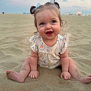 Brooke is registered to the contest to win money with this photo: baby, child, beach, sand, smiling, pigtails, outdoor, cute, happy, person, infant, sky, evening, playful, portrait, sitting, clothing, nature, fun, young